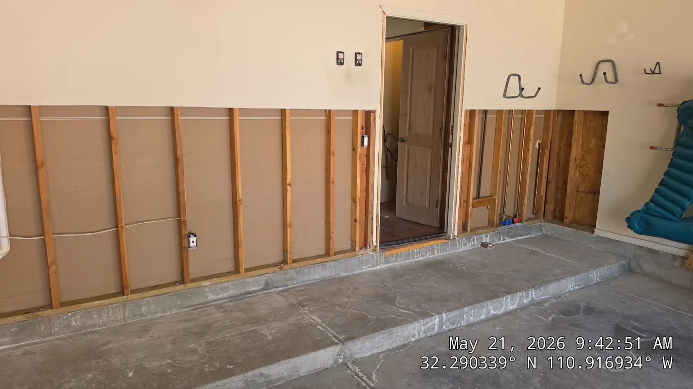 Wall framing and paneling in progress on an Armory new-construction project