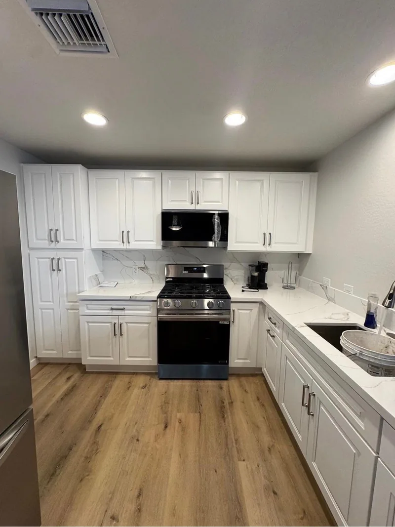 Finished white-and-wood kitchen remodel