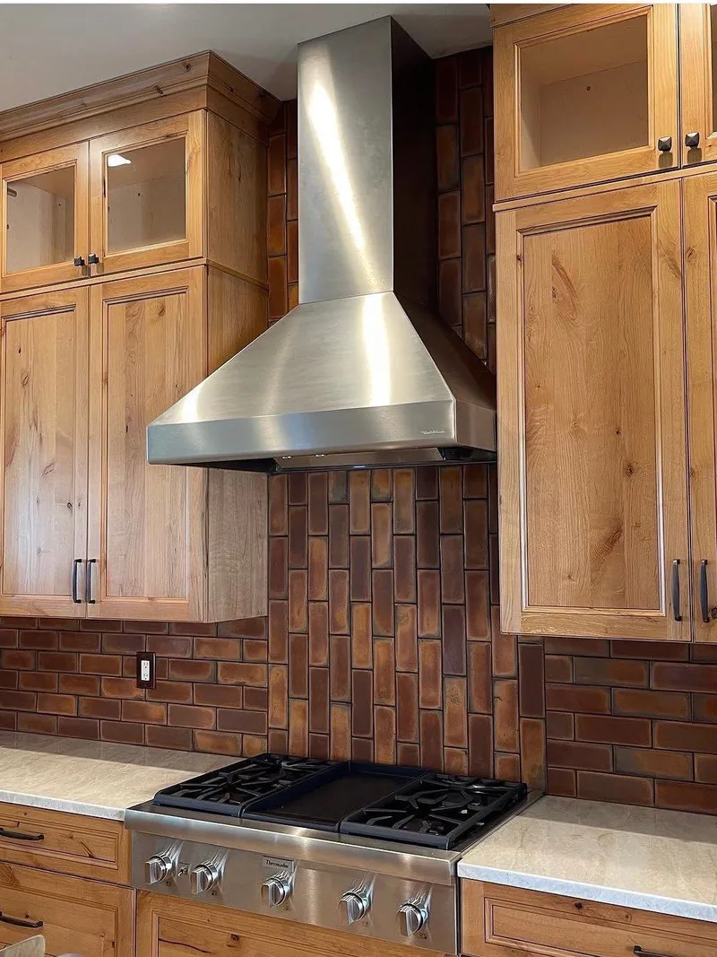 Kitchen remodel with wood cabinetry and tile backsplash