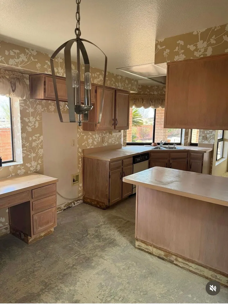Remodeled kitchen with island and pendant lighting