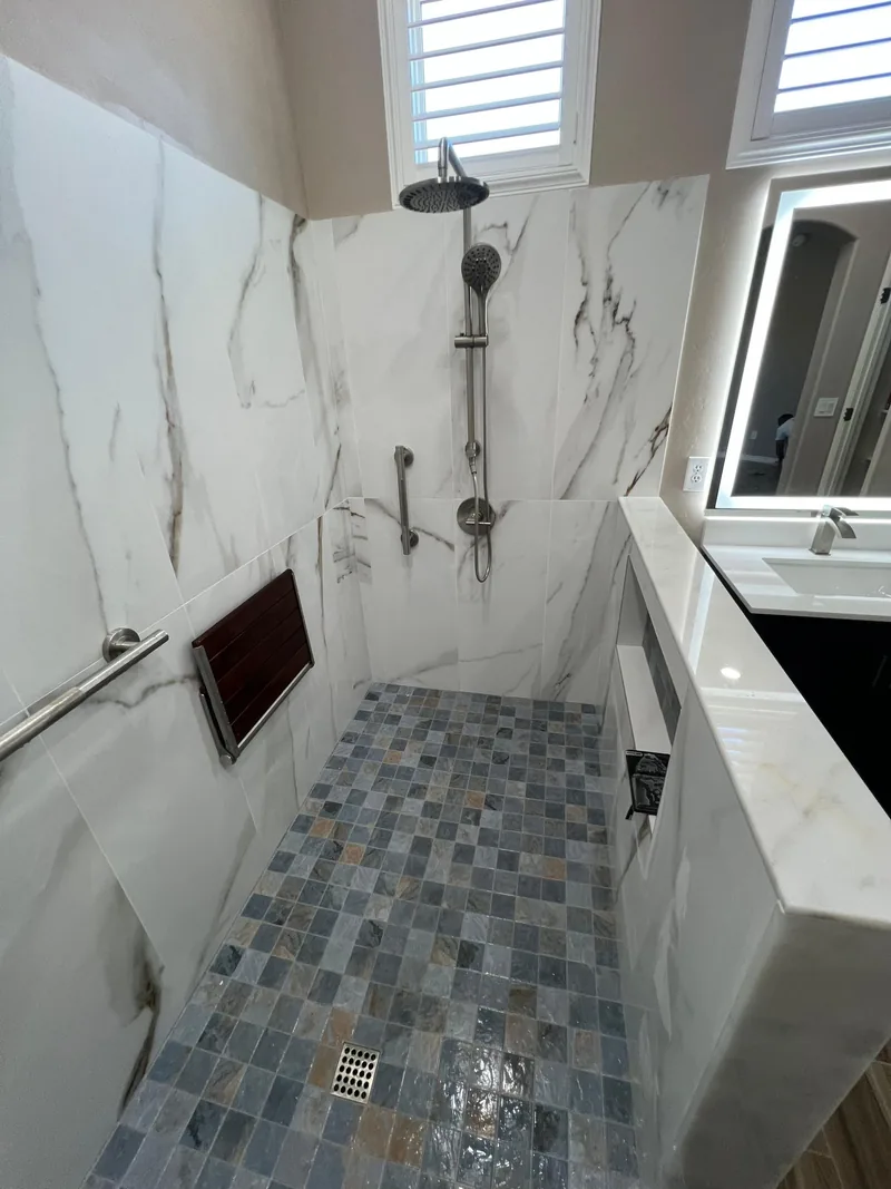 Remodeled bathroom with a tiled walk-in shower